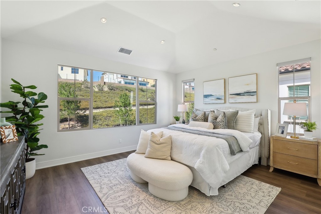 161 Sabbia Irvine, CA 92602 - Photo 6 of 11 a room with a bed and a large window