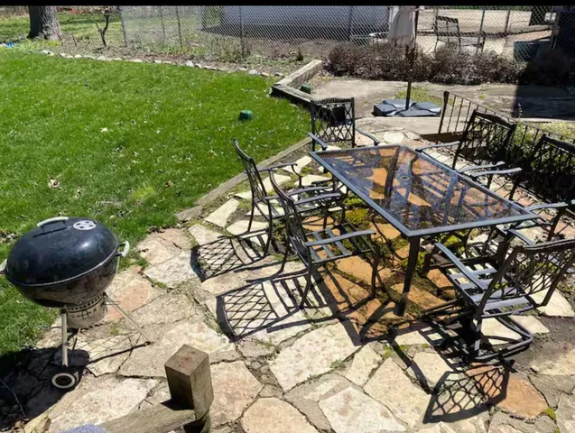 a view of a backyard with sitting area