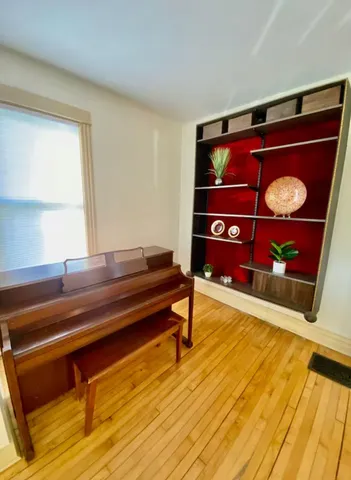 a reading room with wooden floor