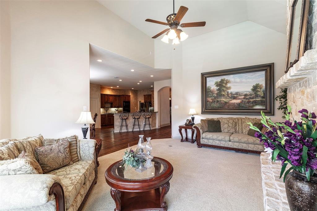 1217 Windmere Way Allen, TX 75013 - Photo 16 of 38 With soaring ceilings and an open flow to the kitchen, this inviting living area was designed for both everyday comfort and effortless entertaining.