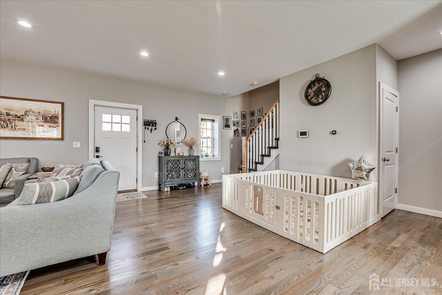 191 Hoover Avenue Edison, NJ 08837 - Photo 12 of 40 a living room with furniture and wooden floor