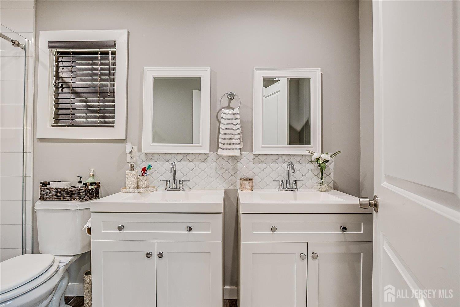 191 Hoover Avenue Edison, NJ 08837 - Photo 23 of 40 a bathroom with a sink and a toilet