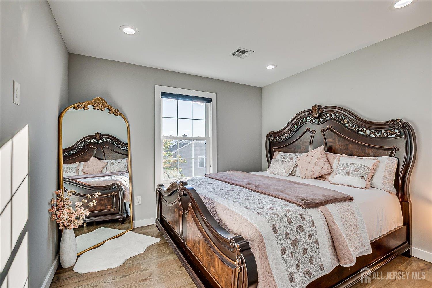 191 Hoover Avenue Edison, NJ 08837 - Photo 26 of 40 a bedroom with a bed and a window