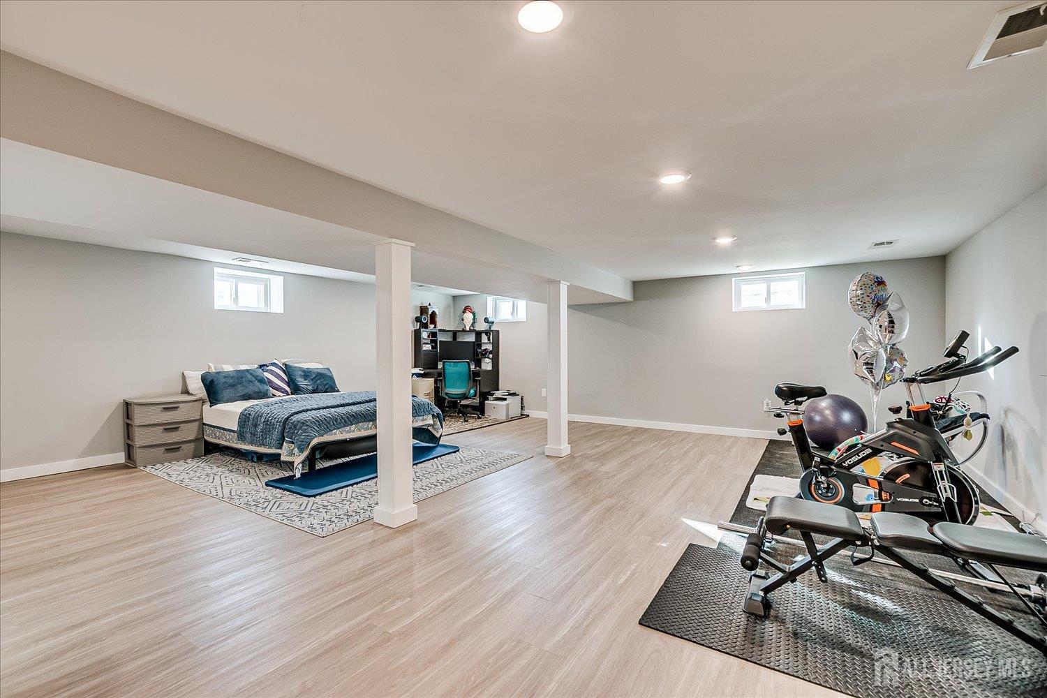 191 Hoover Avenue Edison, NJ 08837 - Photo 31 of 40 a living room with furniture and a wooden floor