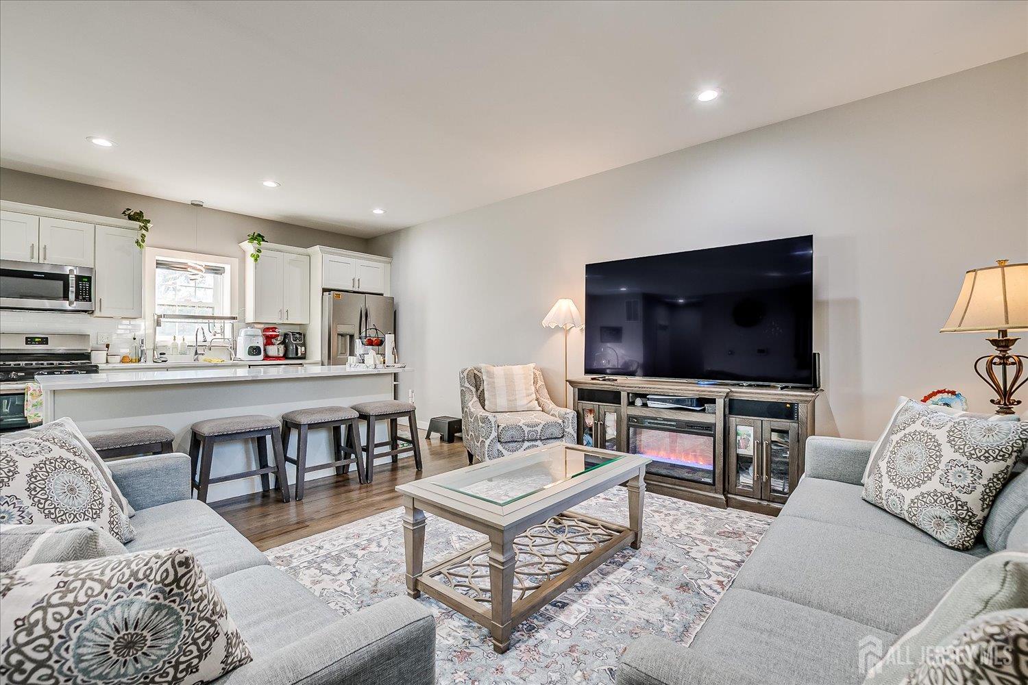 191 Hoover Avenue Edison, NJ 08837 - Photo 9 of 40 a living room with furniture and a flat screen tv