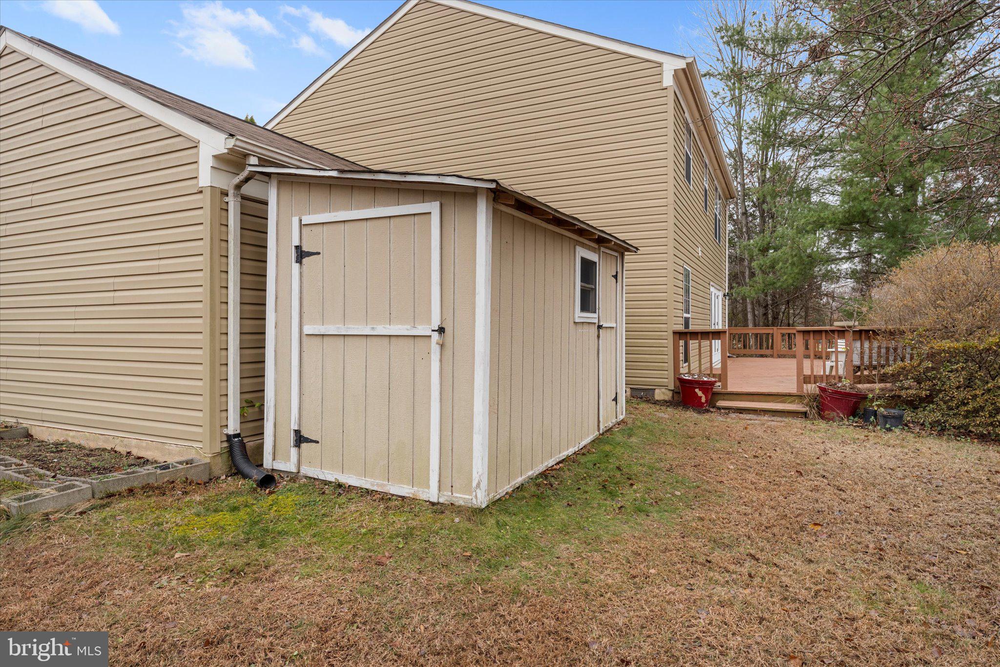 10140 Forest Hill Circle Manassas, VA 20110 - Photo 37 of 42 a view of a house with a backyard
