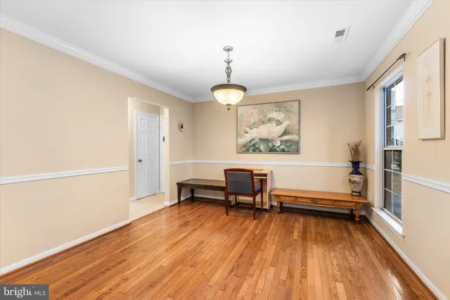 a view of a livingroom with furniture and a window