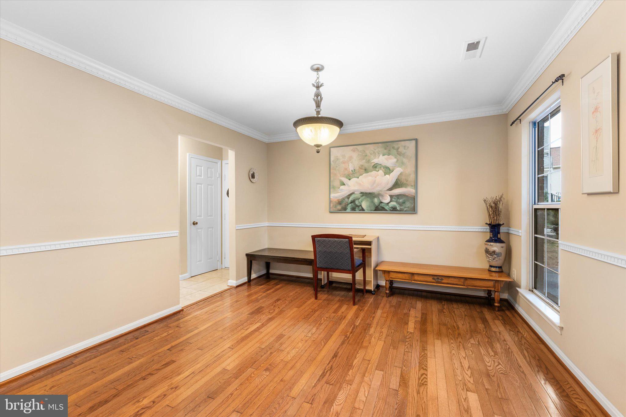 10140 Forest Hill Circle Manassas, VA 20110 - Photo 7 of 42 a view of a livingroom with furniture and a window