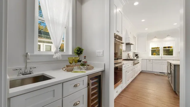 a kitchen with a sink stove and cabinets