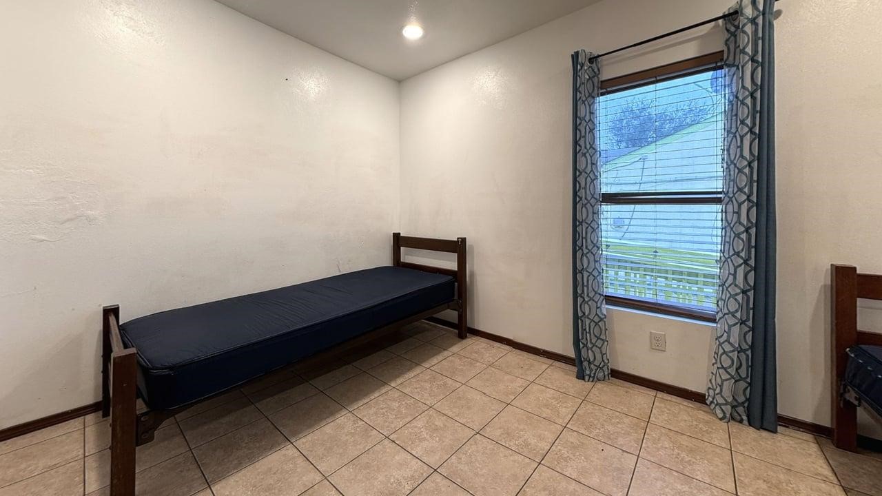 7975 Booker Street Houston, TX 77028 - Photo 11 of 36 a bench sitting in a room next to a window