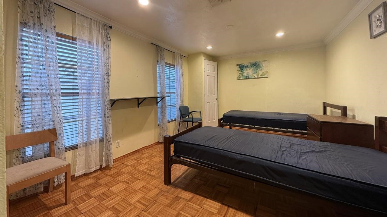 7975 Booker Street Houston, TX 77028 - Photo 18 of 36 a bed room with a bed and furniture