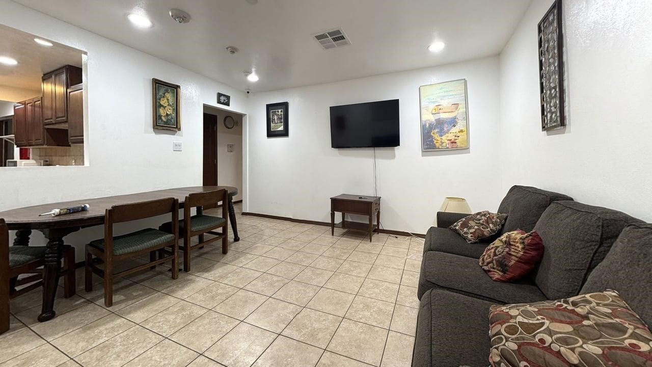 7975 Booker Street Houston, TX 77028 - Photo 24 of 36 a living room with furniture and a flat screen tv