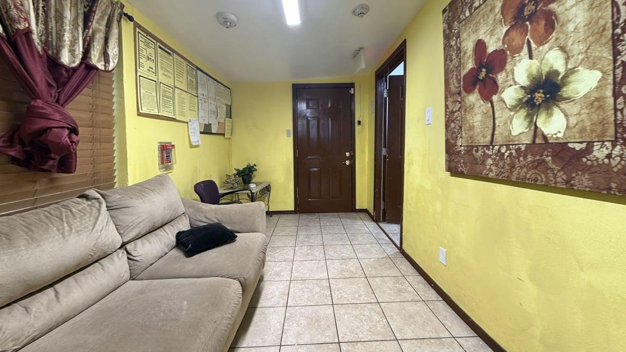 7975 Booker Street Houston, TX 77028 - Photo 26 of 36 a living room with furniture and a rug