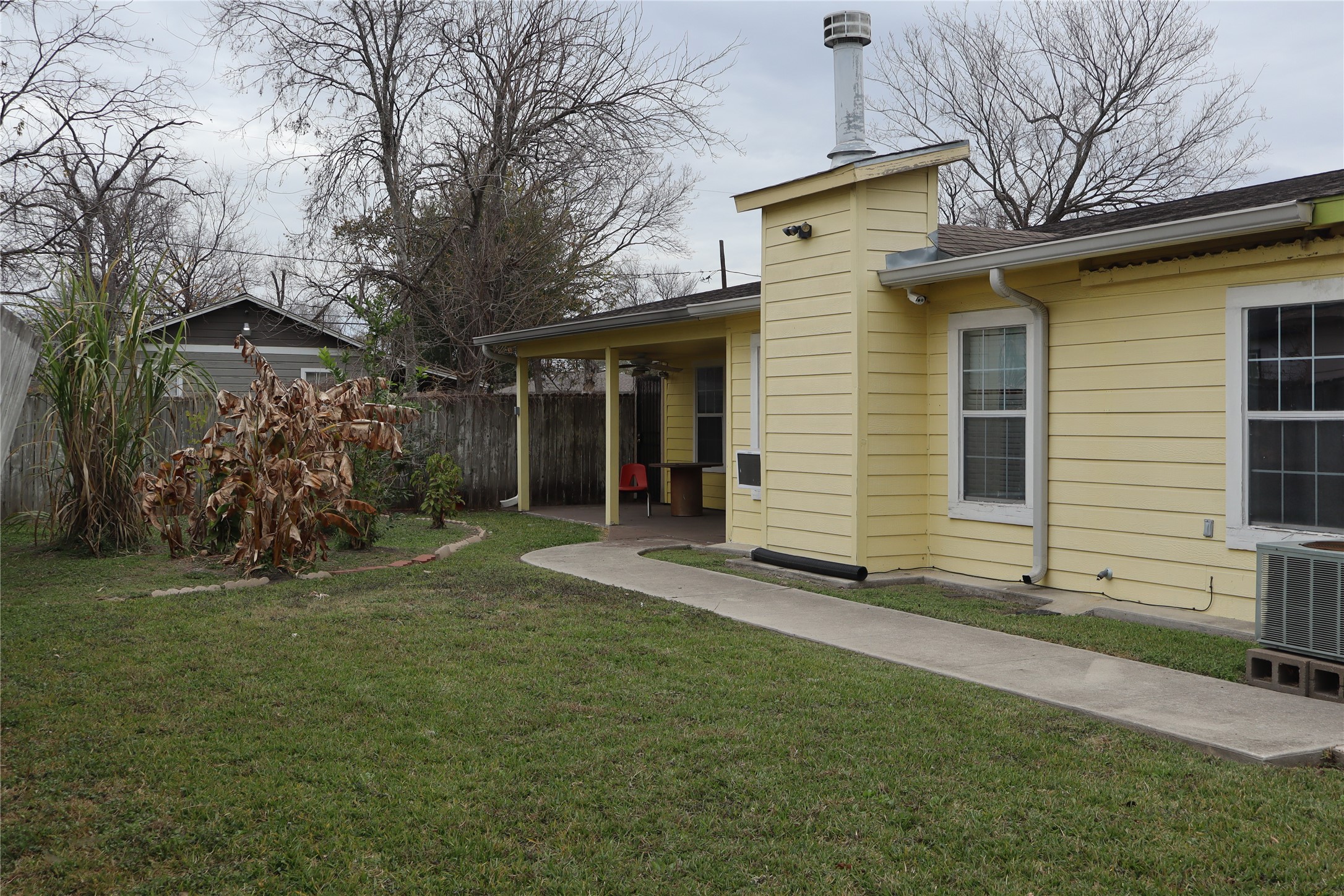 7975 Booker Street Houston, TX 77028 - Photo 28 of 36 a view of a house with a yard