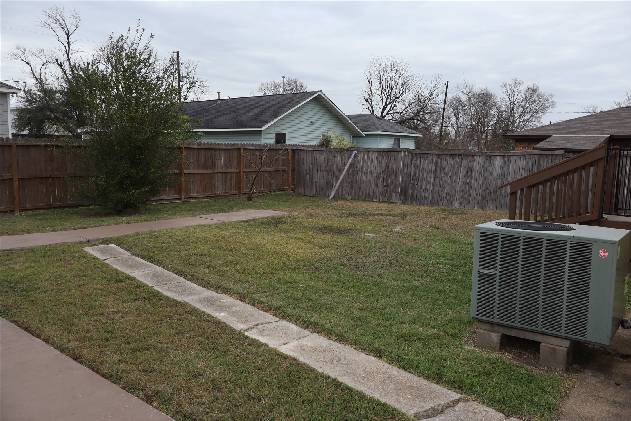 7975 Booker Street Houston, TX 77028 - Photo 32 of 36 a view of a backyard with wooden fence
