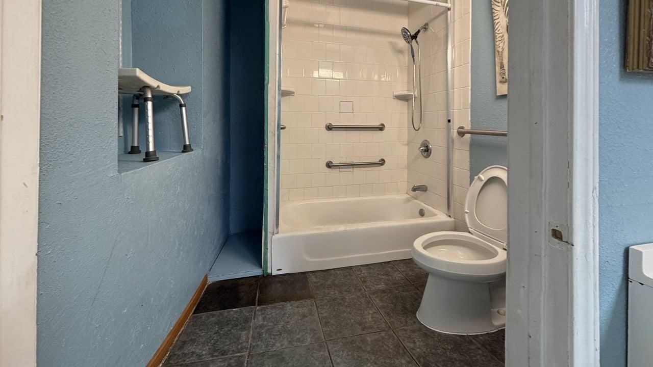 7975 Booker Street Houston, TX 77028 - Photo 5 of 36 a bathroom with a toilet and a shower