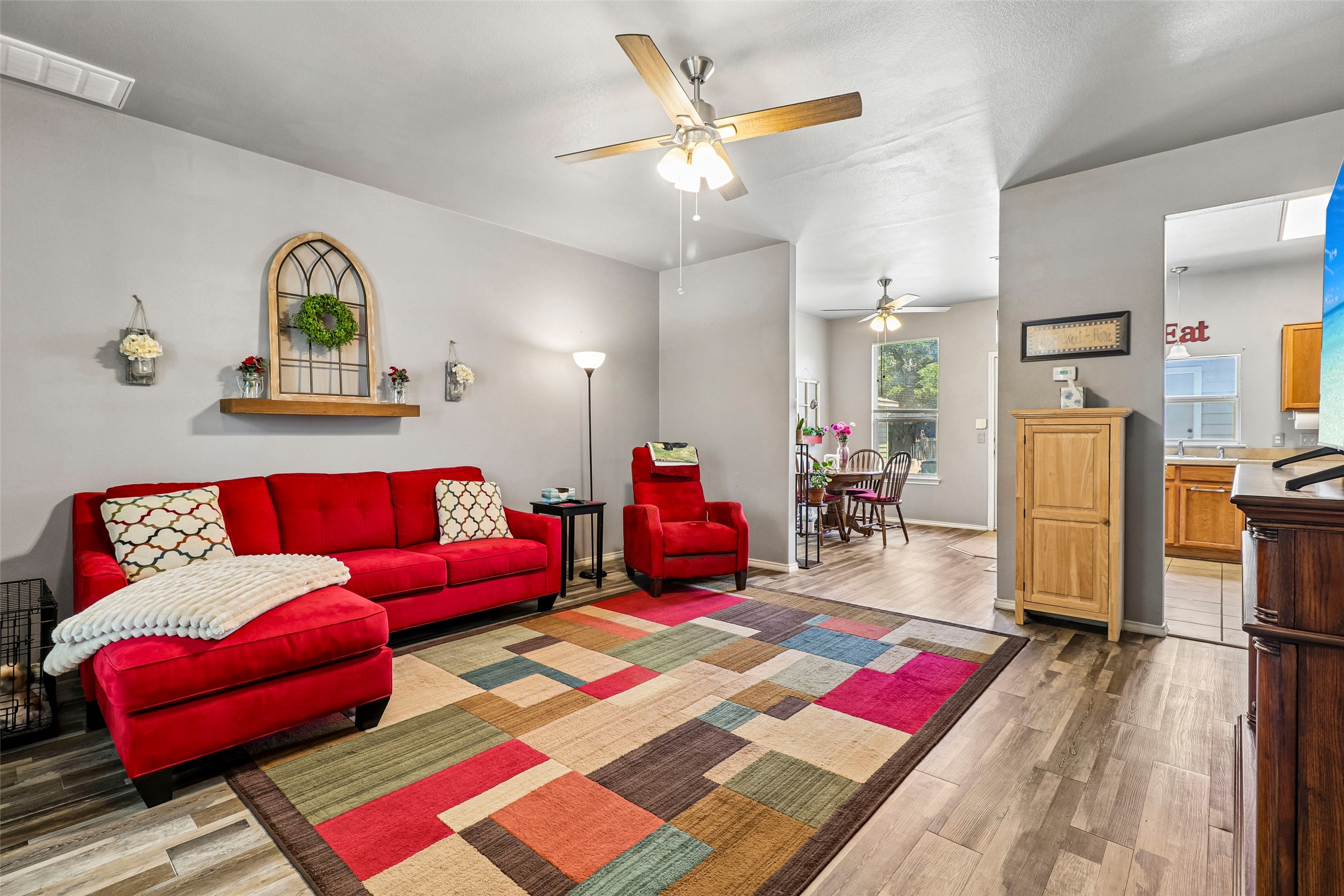 311 A Utterback Kyle, TX 78640 - Photo 4 of 40 a living room with furniture and wooden floor