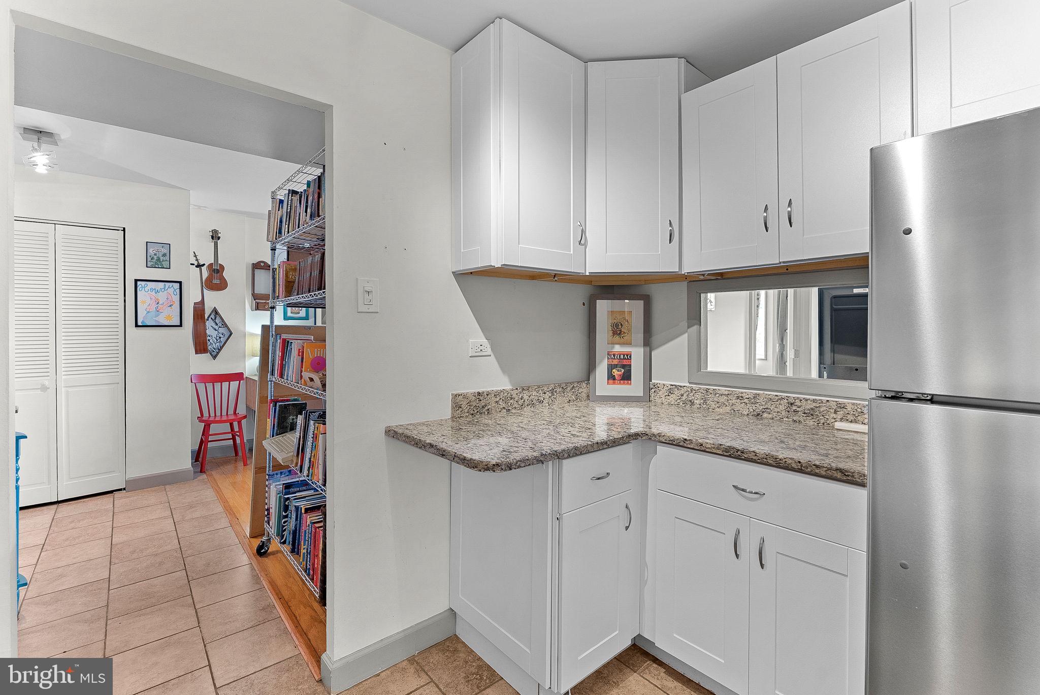 5340 Holmes Run Parkway, Unit 400 Alexandria, VA 22304 - Photo 12 of 40 a kitchen with stainless steel appliances granite countertop a refrigerator and a sink