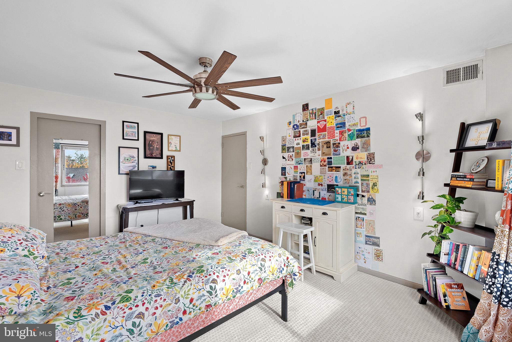 5340 Holmes Run Parkway, Unit 400 Alexandria, VA 22304 - Photo 19 of 40 a bedroom with furniture and a bed