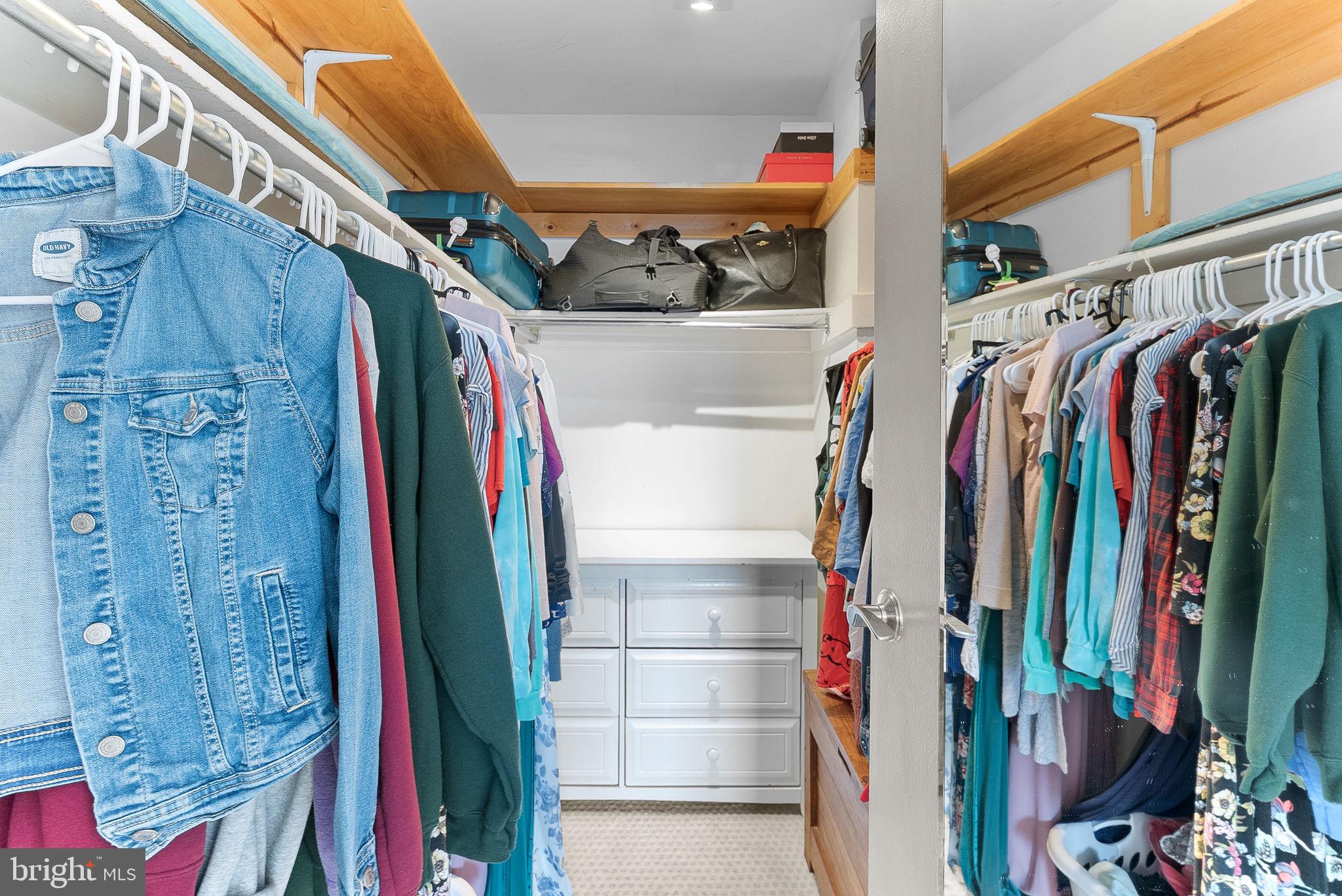 5340 Holmes Run Parkway, Unit 400 Alexandria, VA 22304 - Photo 20 of 40 a view of walk in closet with clothes and shoes