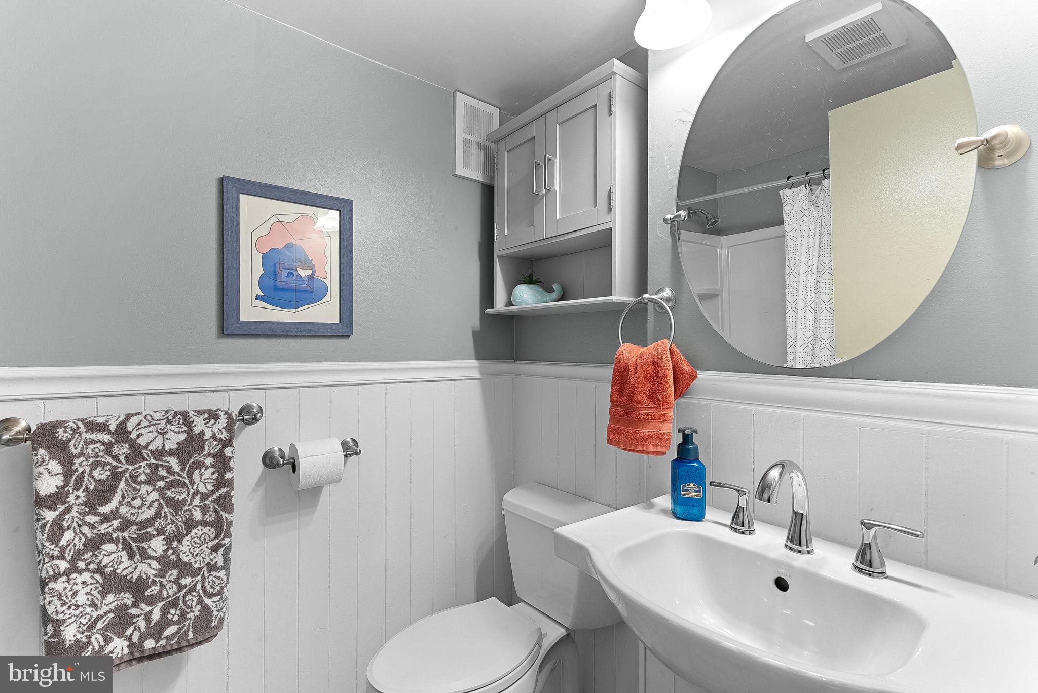 5340 Holmes Run Parkway, Unit 400 Alexandria, VA 22304 - Photo 22 of 40 a bathroom with a toilet sink and mirror