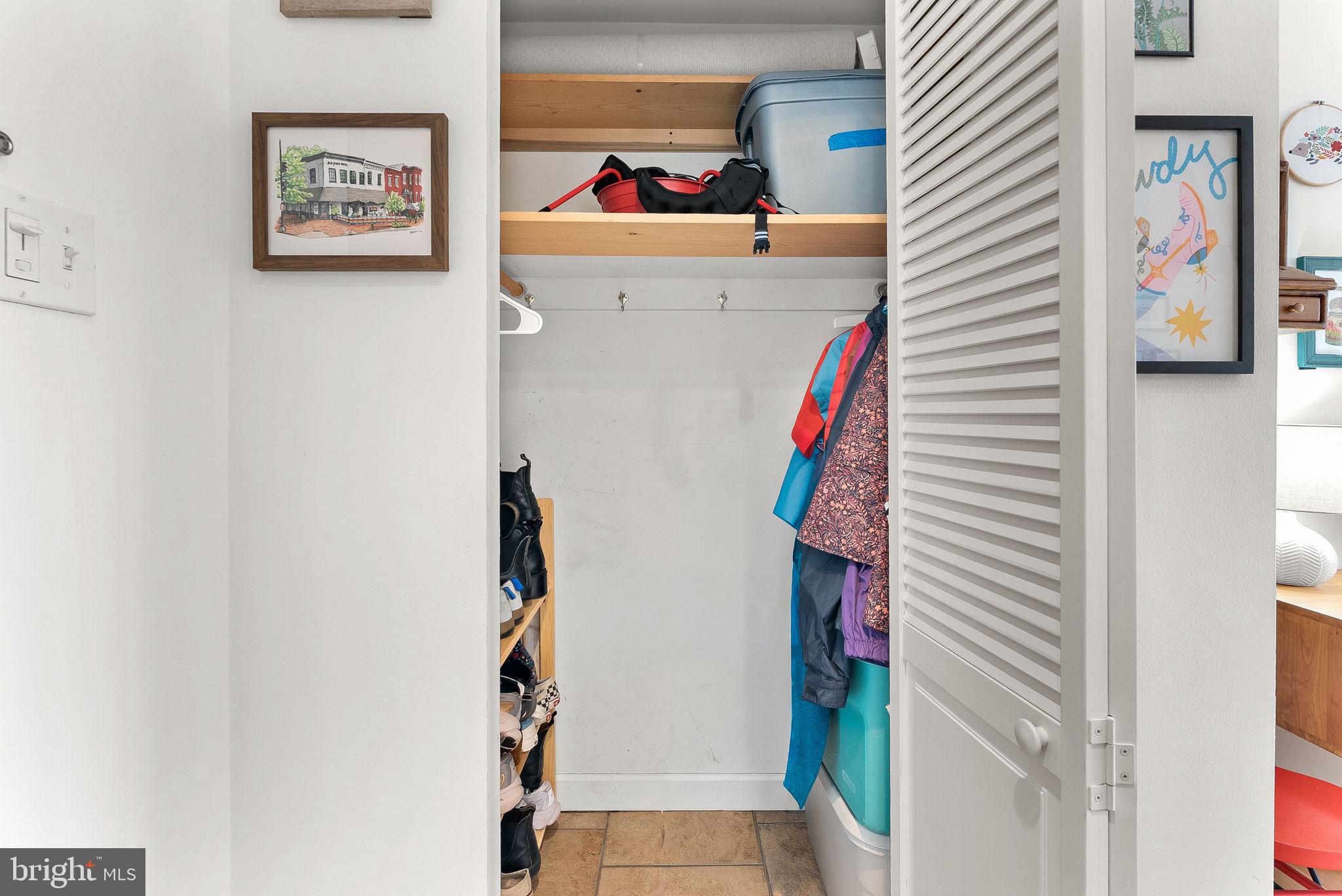 5340 Holmes Run Parkway, Unit 400 Alexandria, VA 22304 - Photo 24 of 40 a view of a hallway with paintings on the wall