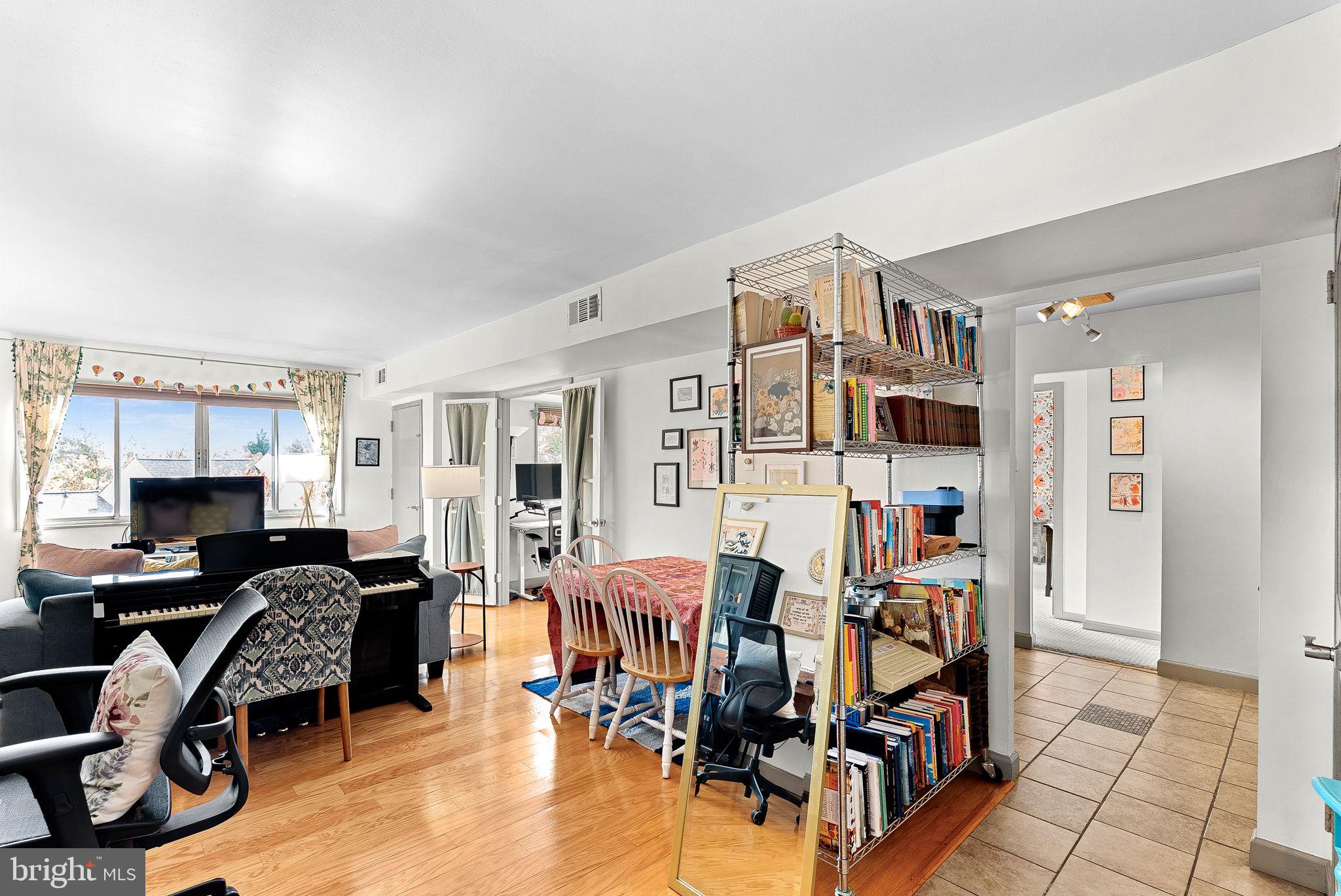 5340 Holmes Run Parkway, Unit 400 Alexandria, VA 22304 - Photo 3 of 40 a view of a livingroom with workspace and a window