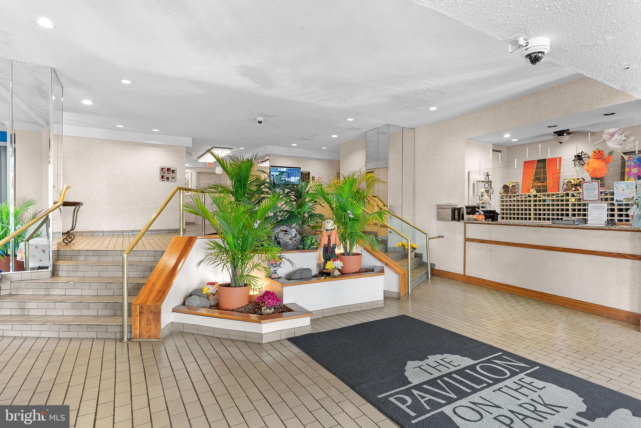 5340 Holmes Run Parkway, Unit 400 Alexandria, VA 22304 - Photo 33 of 40 a living room with furniture and a potted plant