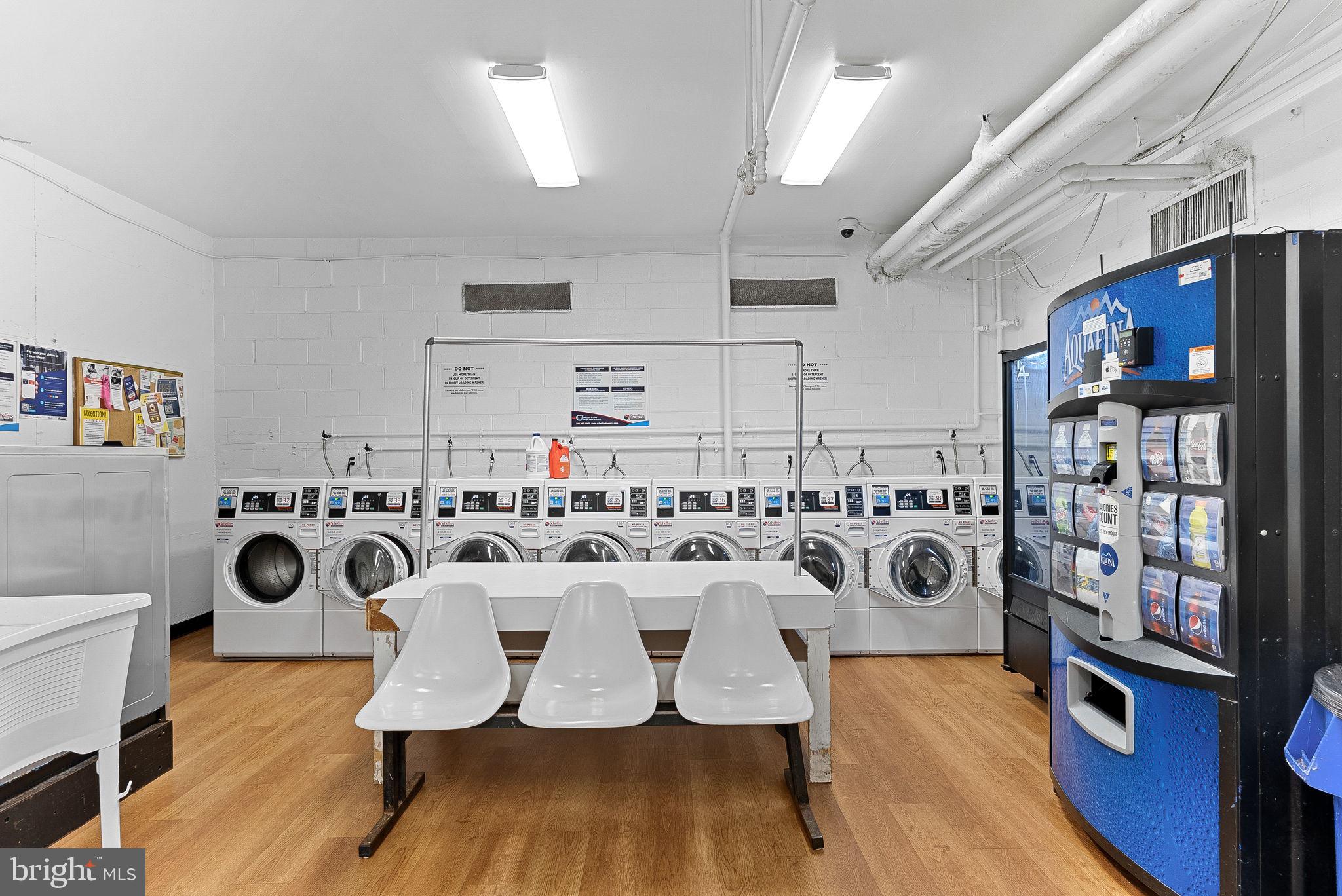 5340 Holmes Run Parkway, Unit 400 Alexandria, VA 22304 - Photo 37 of 40 a view of a kitchen with dining table and chairs