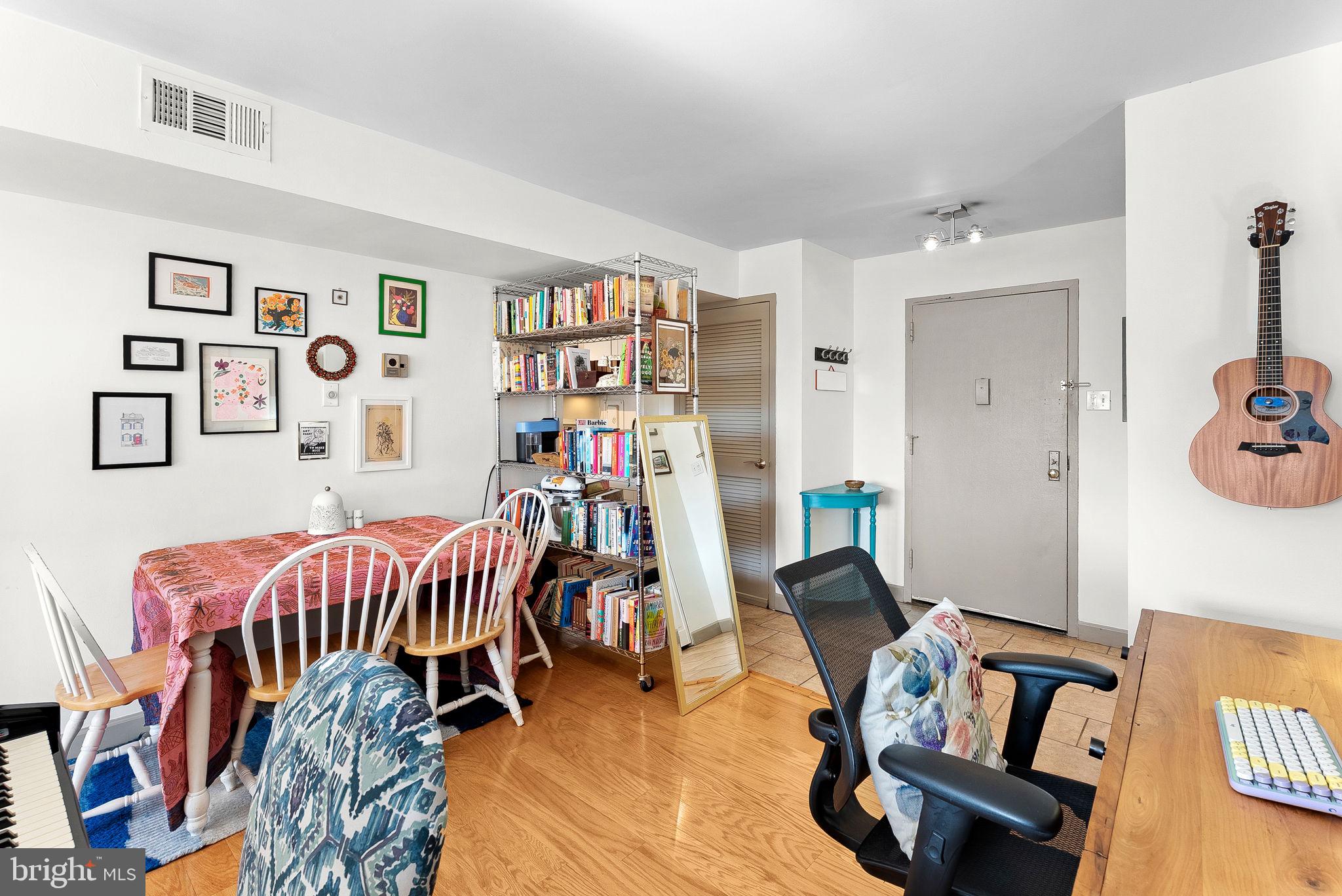 5340 Holmes Run Parkway, Unit 400 Alexandria, VA 22304 - Photo 4 of 40 a bedroom with furniture and a book shelf