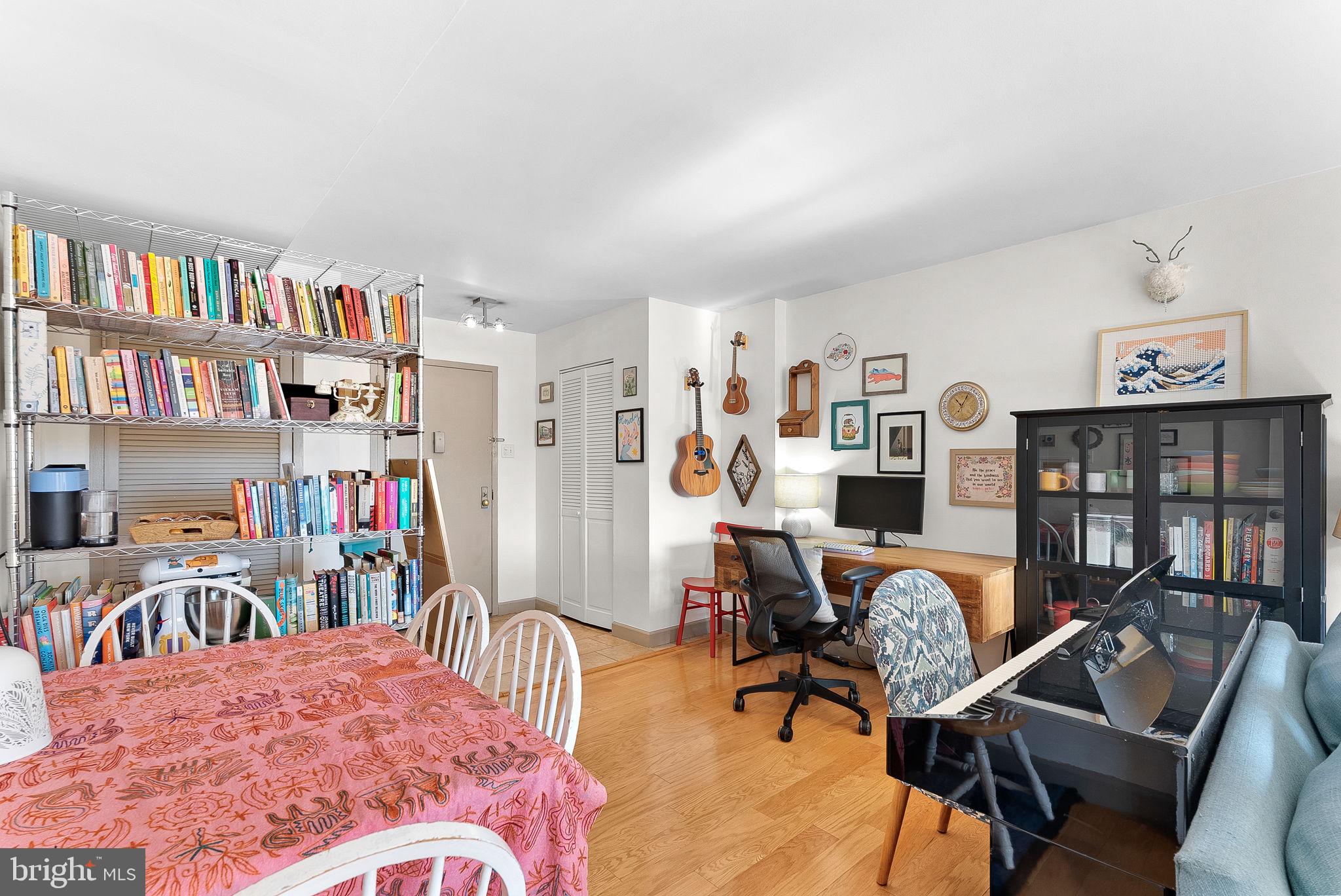 5340 Holmes Run Parkway, Unit 400 Alexandria, VA 22304 - Photo 5 of 40 a bedroom with furniture and a book shelf