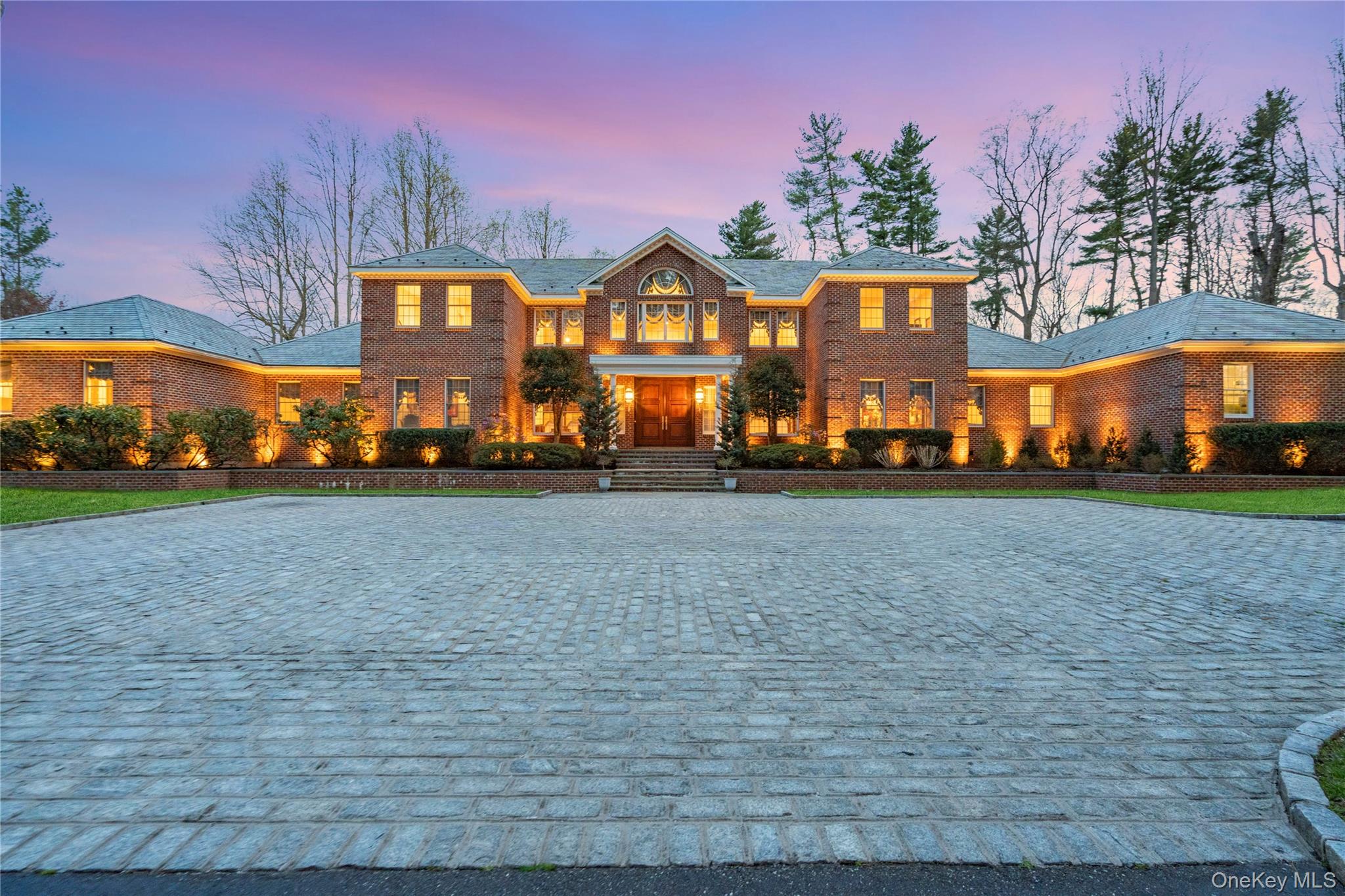 2 Factory Pond Road Locust Valley, NY 11560 - Photo 1 of 1 a front view of a house with a yard