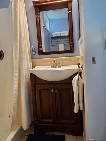 a bathroom with a sink and a mirror