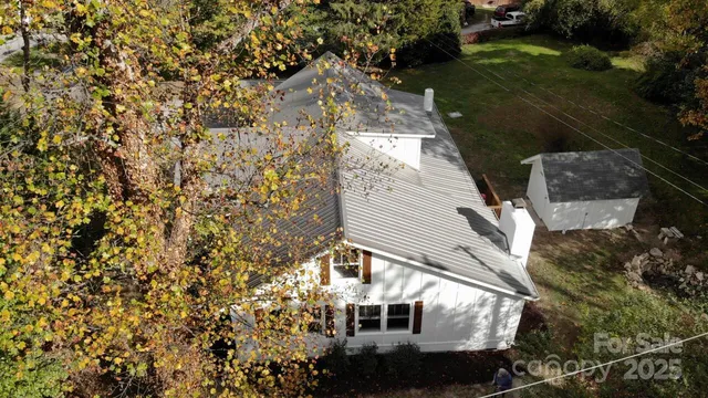 an aerial view of house with yard