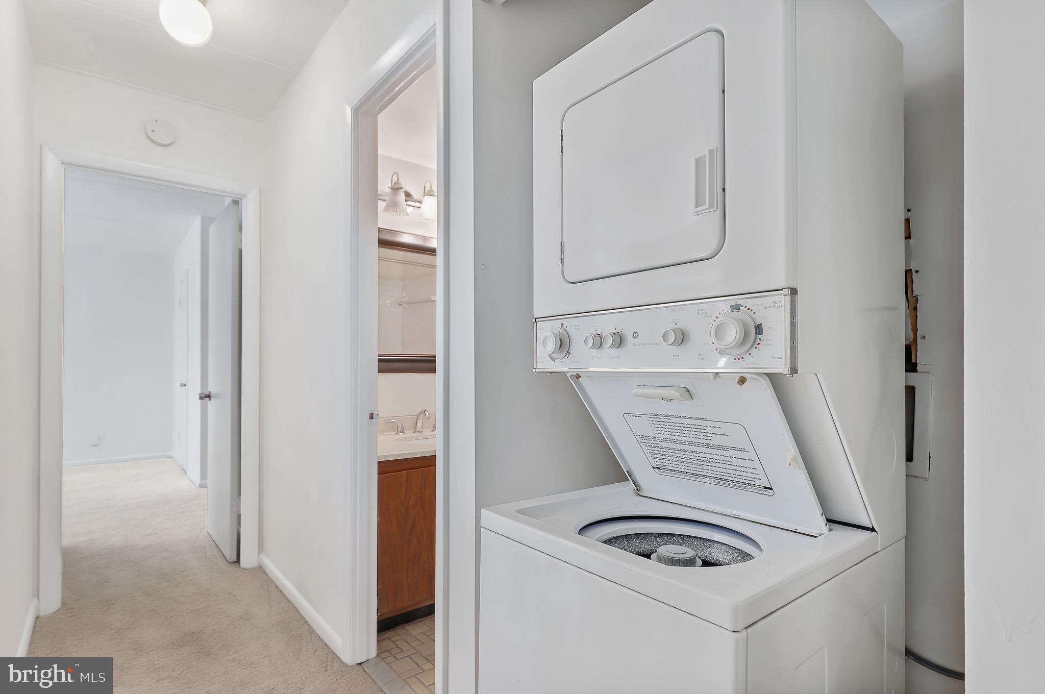 6250 Edsall Road, Unit 203 Alexandria, VA 22312 - Photo 16 of 31 a view of kitchen with washer and dryer