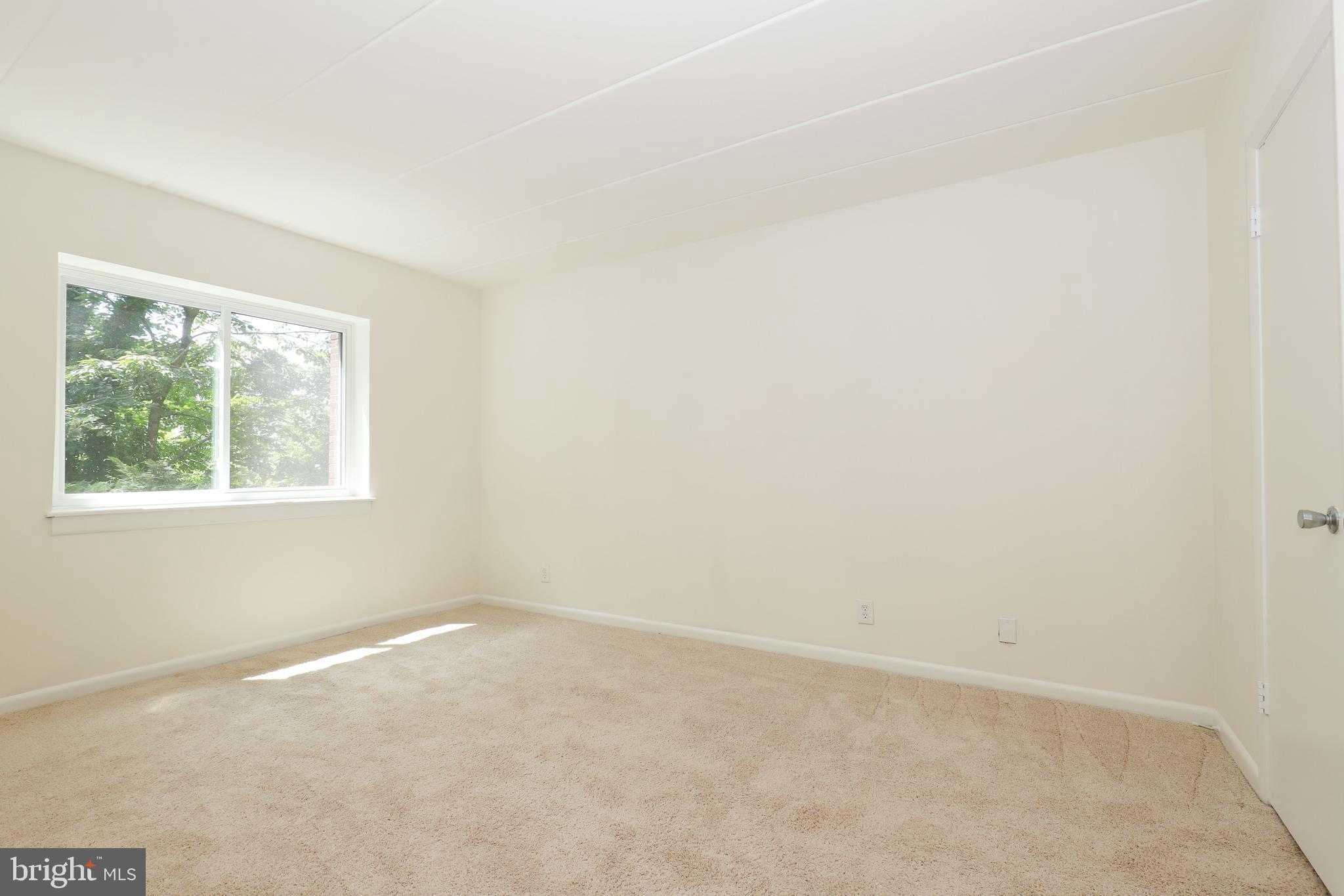 6250 Edsall Road, Unit 203 Alexandria, VA 22312 - Photo 22 of 31 an empty room with a window