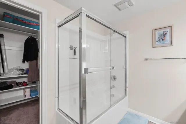 a bathroom with a bathtub and a sink