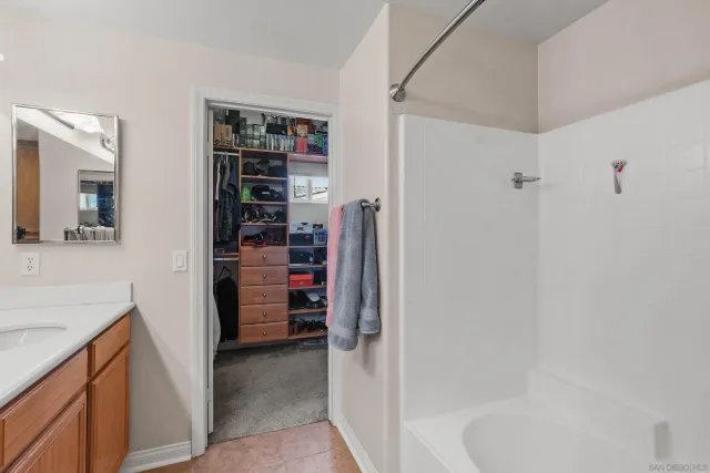 a bathroom with a bathtub and a shower