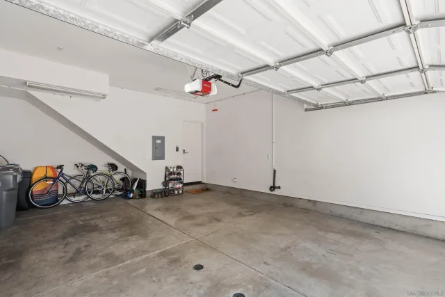 a view of a garage with rack and bicycle