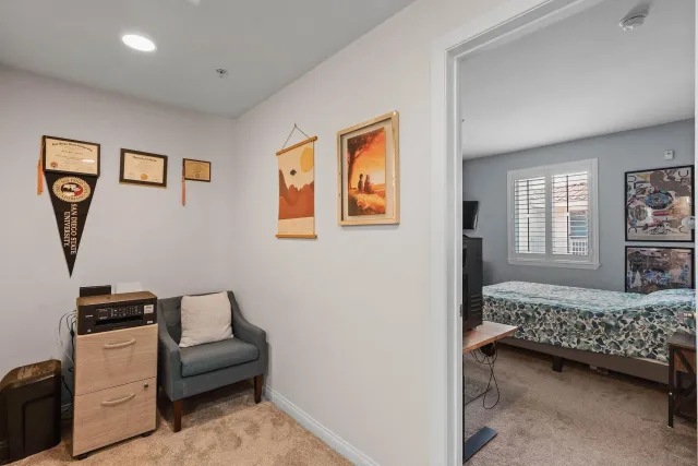 a bedroom with furniture and a window