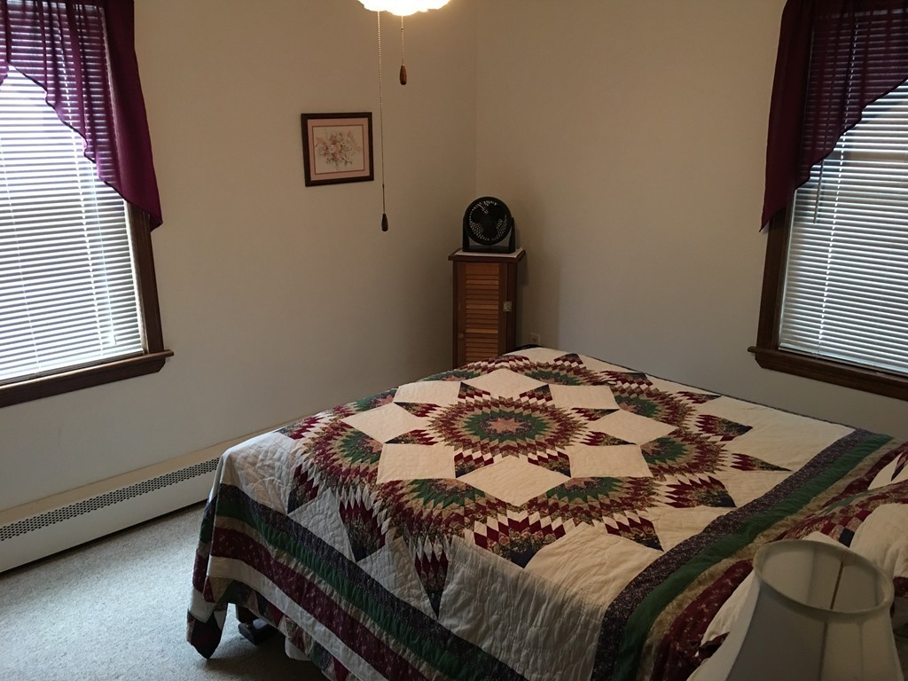 27 Kane Street Springfield, MA 01129 - Photo 5 of 6 a bedroom with a bed and dresser