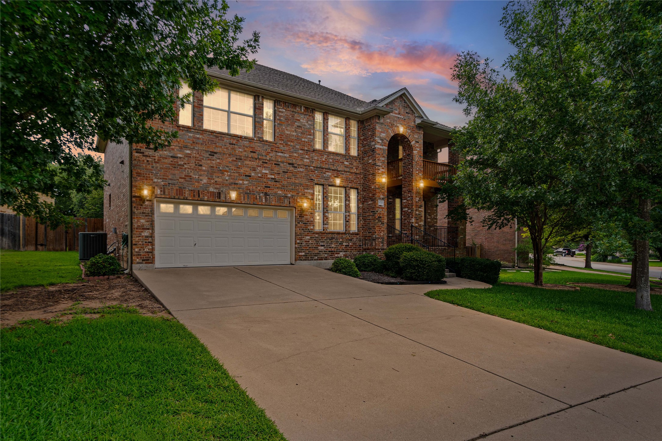 10700 Pointe View Drive Austin, TX 78738 - Photo 1 of 35 A well-maintained brick exterior residence with a concrete driveway offers ample parking and curb appeal.