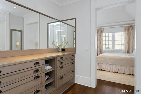 a bathroom with a double vanity sink and a mirror