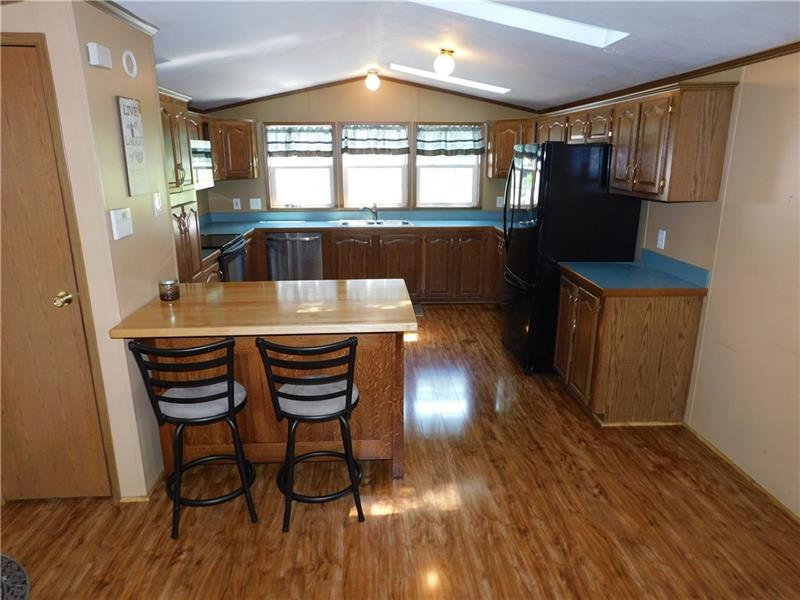 189 Line Road Mercer, PA 16137 - Photo 12 of 25 KITCHEN WITH BREAKFAST BAR, PANTRY AND APPLIANCE PACKAGE