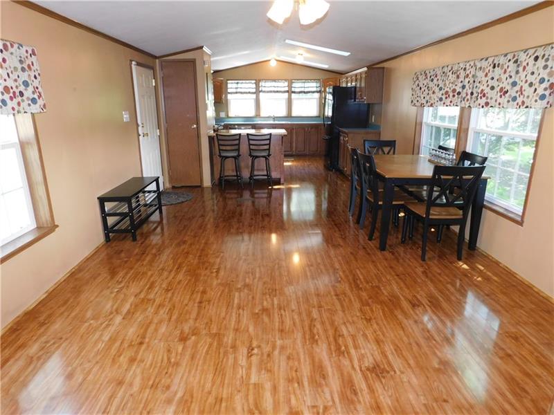 189 Line Road Mercer, PA 16137 - Photo 13 of 25 LARGE OPEN GREAT ROOM WITH DINING AREA/KITCHEN/BREAKFAST BAR