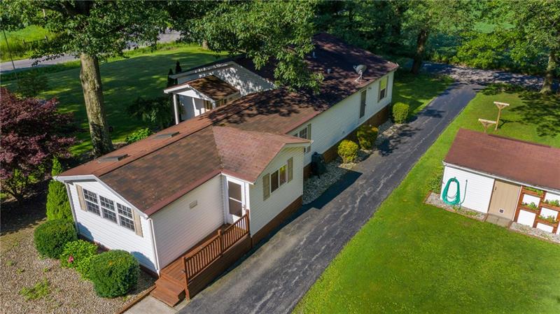 189 Line Road Mercer, PA 16137 - Photo 5 of 25 REAR OF HOME WITH SECOND EXIT OFF 2 ACRE LOT/ WELL HOUSE FOR STORAGE