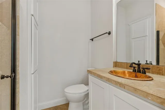 a bathroom with a sink and toilet