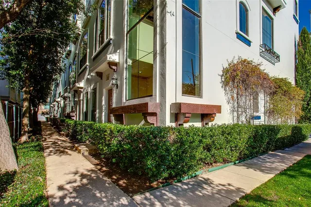 a view of a building with a yard