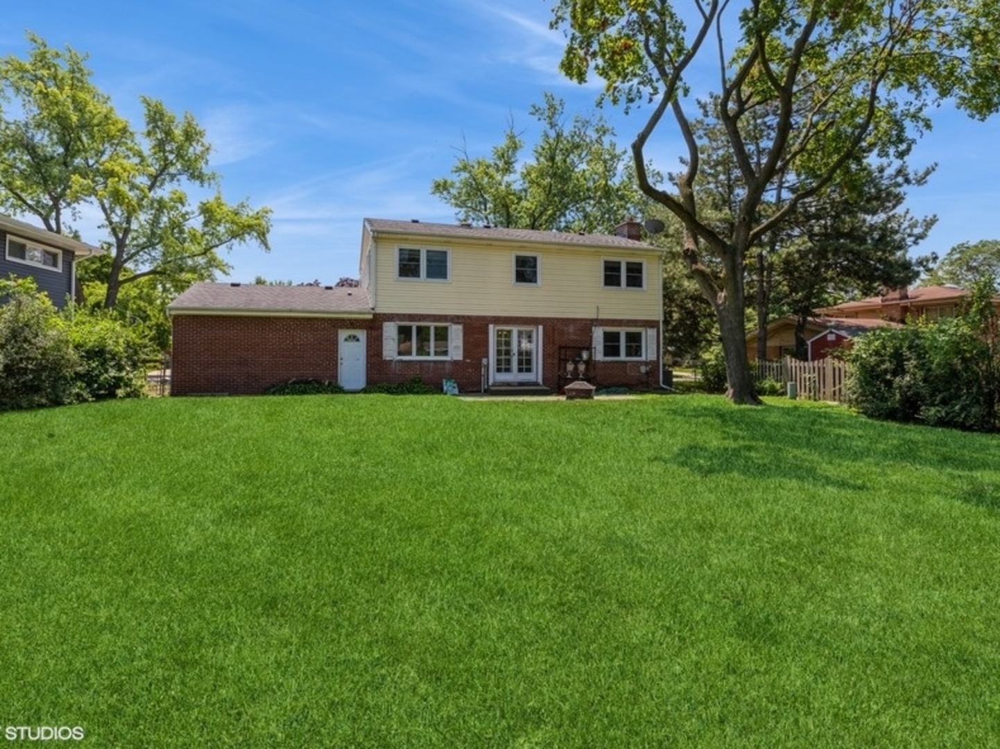 2220 Walnut Street Park Ridge, IL 60068 - Photo 19 of 25 a view of a house with a big yard and large trees
