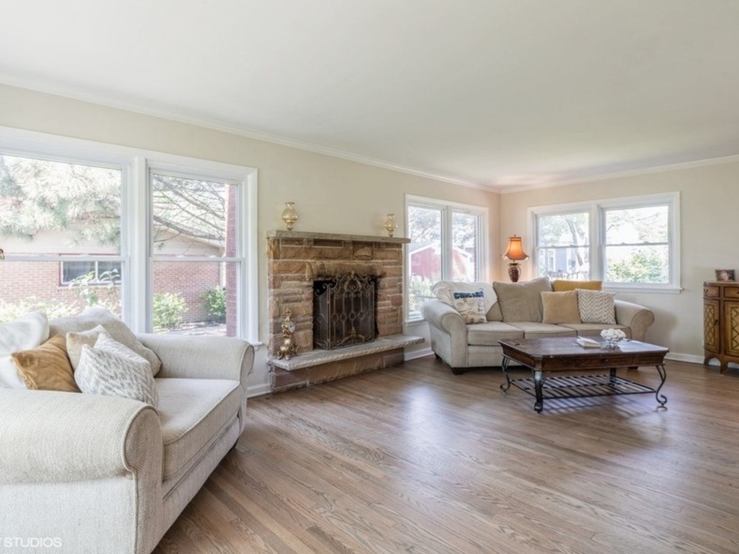 2220 Walnut Street Park Ridge, IL 60068 - Photo 3 of 25 a living room with fireplace furniture and a wooden floor